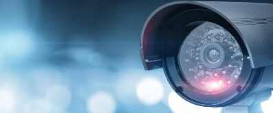 Close-up-of-CCTV-camera-over-defocused-urban-background-1214093147_6901x3881